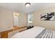 Bedroom with hardwood floors and a view of the backyard at 4017 Sulkirk Rd, Charlotte, NC 28210