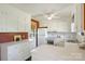 Kitchen with white cabinets, double sink, and view to backyard at 4017 Sulkirk Rd, Charlotte, NC 28210