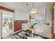 Bright kitchen features white cabinets and flows into dining area at 4017 Sulkirk Rd, Charlotte, NC 28210