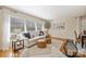 Living room with large windows and a neutral color scheme at 4017 Sulkirk Rd, Charlotte, NC 28210