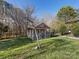 Playhouse in backyard with fenced-in yard and green grass at 500 Planters Way, Mount Holly, NC 28120