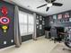 Bedroom with gaming setup and superhero decor at 500 Planters Way, Mount Holly, NC 28120