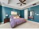 Bright bedroom with large mirror and ceiling fan at 500 Planters Way, Mount Holly, NC 28120