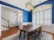 Dining room with hardwood floors and a large window with shutters at 500 Planters Way, Mount Holly, NC 28120