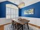 Dining room features hardwood floors and blue walls at 500 Planters Way, Mount Holly, NC 28120