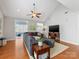 Relaxing living room, hardwood floors, sectional sofa, and large TV at 500 Planters Way, Mount Holly, NC 28120