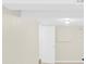 Basement featuring neutral walls and flooring, a drop ceiling, and a doorway at 9106 Nash Ave, Charlotte, NC 28213