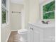 Bathroom featuring a vanity, toilet, and window with bright natural light at 9106 Nash Ave, Charlotte, NC 28213