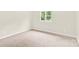 Bedroom featuring neutral carpet, walls, and a window bringing in natural light at 9106 Nash Ave, Charlotte, NC 28213