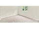 Bedroom featuring neutral carpet, walls, and a window bringing in natural light at 9106 Nash Ave, Charlotte, NC 28213