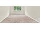 Neutral bedroom offering plush carpet, natural light, and ample space at 9106 Nash Ave, Charlotte, NC 28213