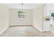 Dining area featuring hardwood flooring and natural lighting with open access to the kitchen at 9106 Nash Ave, Charlotte, NC 28213