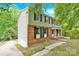 Two-story home boasts brick accents, siding, a covered porch, and a deck at 9106 Nash Ave, Charlotte, NC 28213