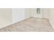 View of the living room showcasing wood flooring and a window with bright natural light at 9106 Nash Ave, Charlotte, NC 28213