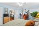 Bedroom with light blue walls, hardwood floors, and view into living room at 129 Ann St, Salisbury, NC 28146