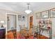 Cozy dining area with hardwood floors and a round glass-top table at 129 Ann St, Salisbury, NC 28146