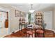 Charming dining room features hardwood floors and a glass-top table with four chairs at 129 Ann St, Salisbury, NC 28146
