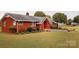 Brick ranch house with landscaped yard and walkway at 129 Ann St, Salisbury, NC 28146