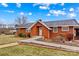 Brick ranch home with landscaped gardens and walkway at 129 Ann St, Salisbury, NC 28146