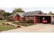 Brick ranch home with carport and landscaped yard at 129 Ann St, Salisbury, NC 28146