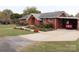Brick ranch home with carport and landscaped yard at 129 Ann St, Salisbury, NC 28146