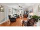 Bright living room with hardwood floors, fireplace, and view into adjacent room at 129 Ann St, Salisbury, NC 28146
