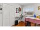 Home office with window, built-in closet, and sewing space at 129 Ann St, Salisbury, NC 28146