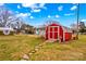 Charming red barn with gray roof and stone pathway at 129 Ann St, Salisbury, NC 28146
