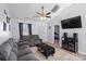 Living room with gray sectional sofa, coffee table, and flat-screen TV at 1439 Clooney Ln, Charlotte, NC 28262