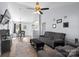 Open living room with gray sectional and dining area at 1439 Clooney Ln, Charlotte, NC 28262