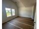 Bright bedroom featuring newly painted walls and two large windows at 184 Maplewood Ln, Taylorsville, NC 28681