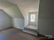 Sunlit bedroom featuring a window, freshly painted walls, and a unique layout at 184 Maplewood Ln, Taylorsville, NC 28681
