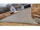 Long concrete driveway leading up to a partially-constructed home at 184 Maplewood Ln, Taylorsville, NC 28681