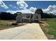Charming new construction home featuring a gray exterior, dormer windows, and an attached two car carport at 184 Maplewood Ln, Taylorsville, NC 28681