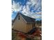 Exterior side view of home under construction with siding incomplete and wooden framework visible at 184 Maplewood Ln, Taylorsville, NC 28681