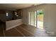 Unfinished kitchen featuring light wood cabinets and sliding glass doors to the outdoor wooden deck at 184 Maplewood Ln, Taylorsville, NC 28681
