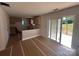 Unfinished kitchen with bare walls, light wood cabinets, and sliding glass doors to the outdoor wooden deck at 184 Maplewood Ln, Taylorsville, NC 28681
