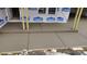 Newly poured concrete porch with support posts on the exterior of home under construction at 184 Maplewood Ln, Taylorsville, NC 28681