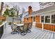 A back deck with an outdoor dining set and swing seat at 3319 Mill Pond Rd, Charlotte, NC 28226