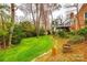 A back yard with a well-manicured lawn and a deck at 3319 Mill Pond Rd, Charlotte, NC 28226