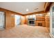 Basement with tiled floor features a stone fireplace, built-in shelving, and a small desk area, offering functionality at 3319 Mill Pond Rd, Charlotte, NC 28226