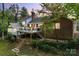 Brick house with large deck and landscaping at 3319 Mill Pond Rd, Charlotte, NC 28226