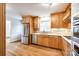 Modern kitchen featuring stainless steel appliances, wooden cabinets, and ample counter space for food preparation at 3319 Mill Pond Rd, Charlotte, NC 28226