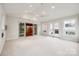 Bright sunroom featuring carpet, multiple doors, and a ceiling fan at 3319 Mill Pond Rd, Charlotte, NC 28226