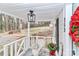 Cozy front porch with white railing and view of backyard at 353 Lee St, Mooresville, NC 28115