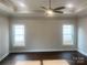 Spacious bedroom featuring a trey ceiling, ceiling fan, hardwood floors, and abundant natural light at 4033 Stadler Ne Dr # 22, Conover, NC 28613
