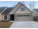 Charming home with a neutral color palette, complemented by stone accents and an attached two-car garage at 4033 Stadler Ne Dr # 22, Conover, NC 28613