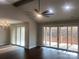Open living room with dark wood floors and sliding glass doors that lead to the backyard at 4033 Stadler Ne Dr # 22, Conover, NC 28613