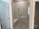 Modern shower with glass door, bench, and dual shower heads is the focus of this bright bathroom at 4033 Stadler Ne Dr # 22, Conover, NC 28613