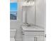 Bright bathroom with vanity with marble counter, modern lighting, and toilet at 8005 Elevate Ct, Charlotte, NC 28205